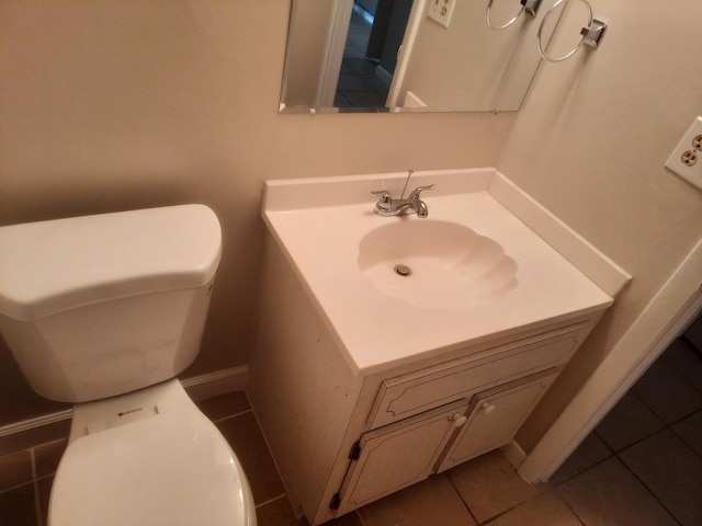 bathroom with tile patterned floors, vanity, and toilet