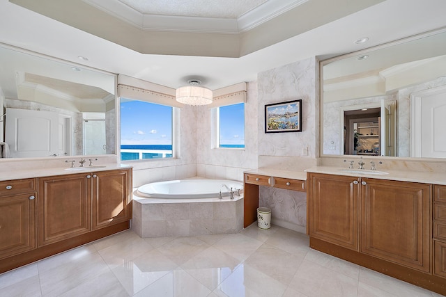 full bathroom with a shower stall, a sink, a bath, and crown molding