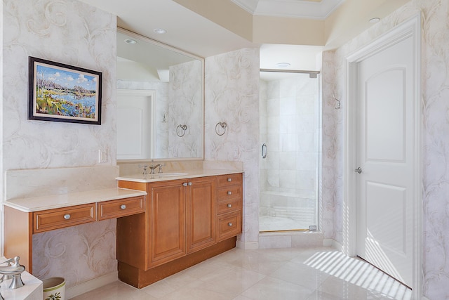 bathroom with ornamental molding, a stall shower, vanity, and tile patterned floors