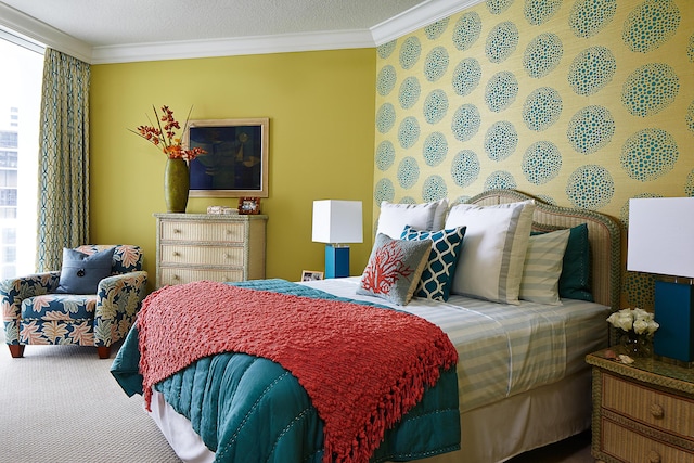 bedroom featuring ornamental molding, carpet flooring, and multiple windows