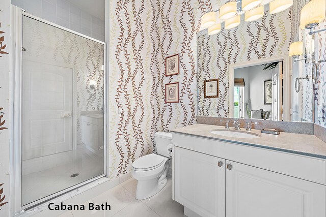 full bathroom featuring toilet, wallpapered walls, a stall shower, and tile patterned floors