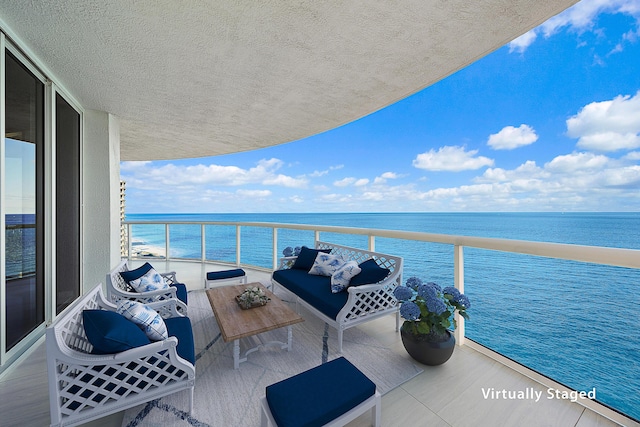 balcony featuring a water view