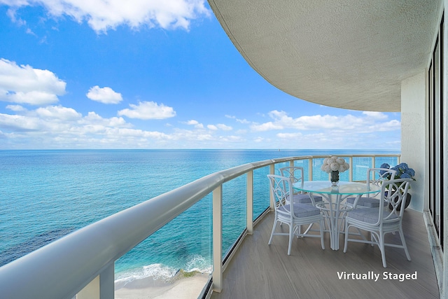 balcony featuring a water view