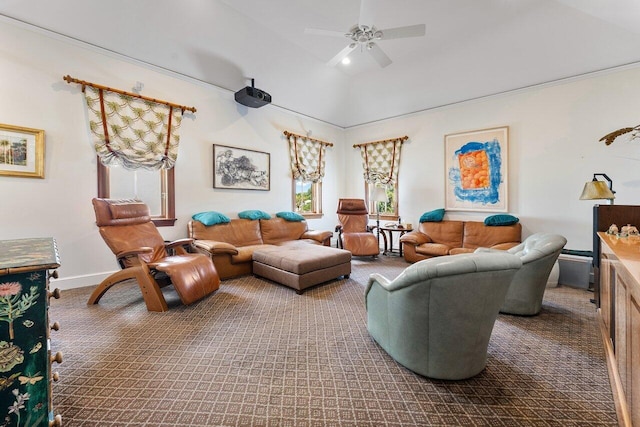 living room with ceiling fan, carpet, and vaulted ceiling