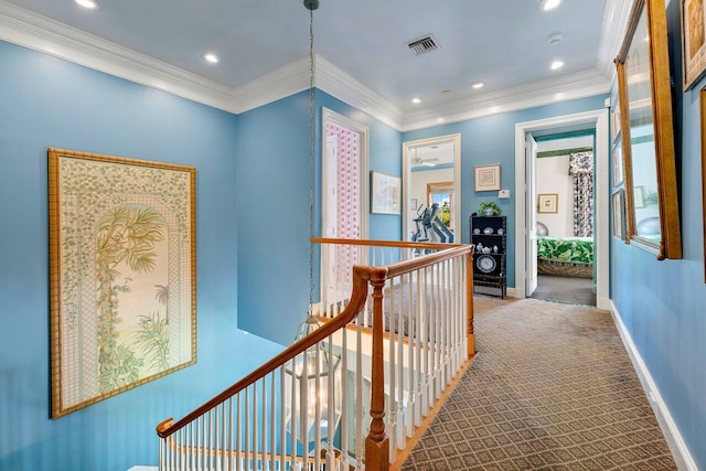 corridor featuring carpet flooring and ornamental molding