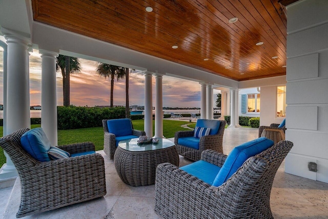 view of patio terrace at dusk