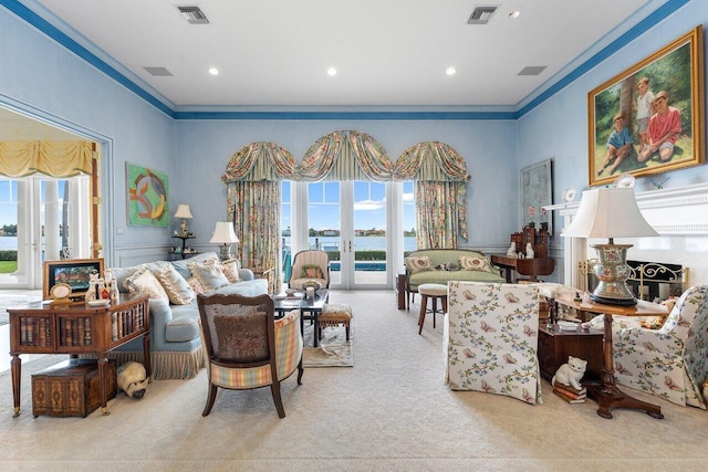 living room featuring a wealth of natural light, french doors, light carpet, and ornamental molding