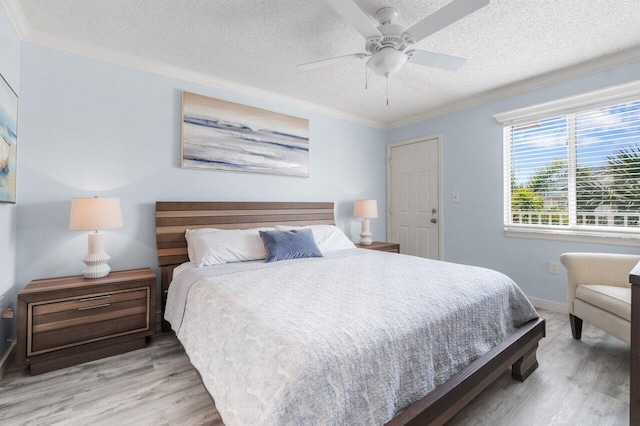 bedroom featuring a textured ceiling, hardwood / wood-style flooring, and ceiling fan