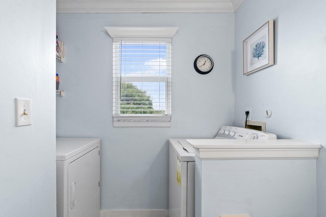 laundry room featuring washer and clothes dryer and ornamental molding