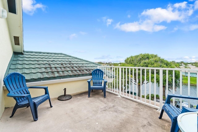 balcony featuring a water view