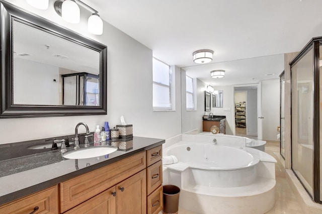 bathroom with vanity and plus walk in shower