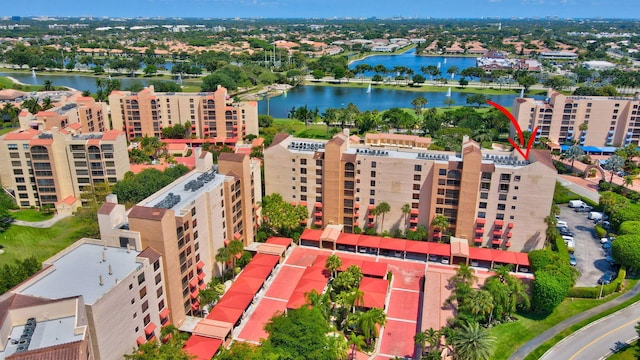 birds eye view of property with a water view