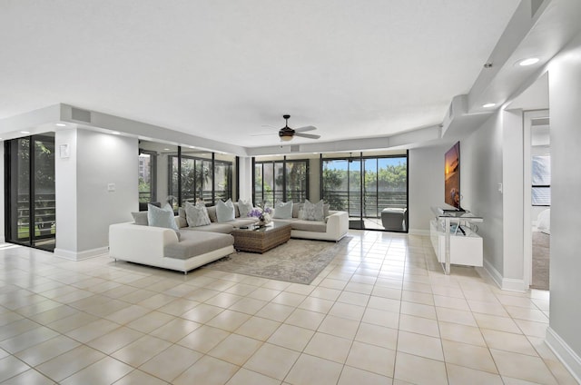 living room with ceiling fan and light tile patterned floors