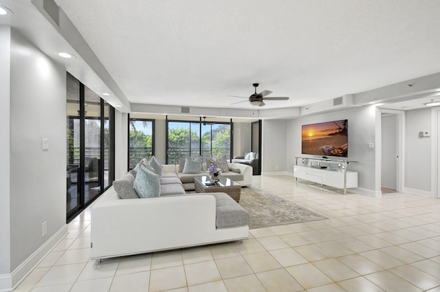 tiled living room featuring ceiling fan