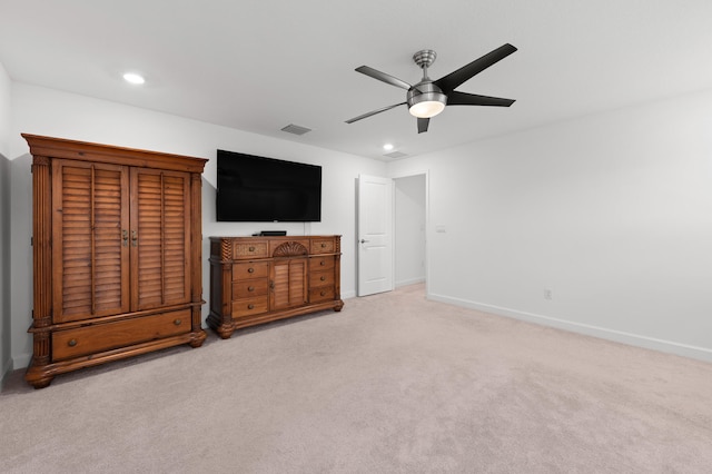 unfurnished bedroom featuring ceiling fan and light colored carpet