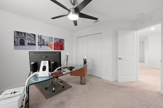 carpeted office space with ceiling fan