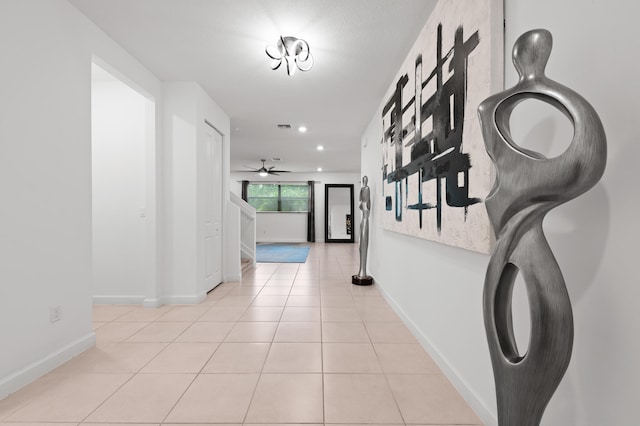 hall featuring light tile patterned flooring