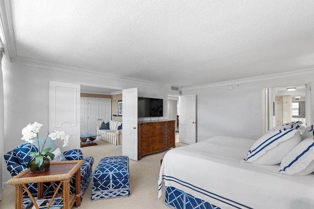 bedroom with ornamental molding and light colored carpet