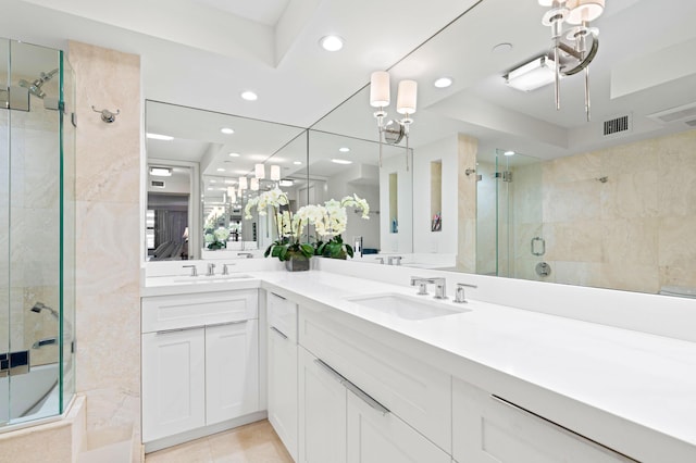 full bath featuring a stall shower, a sink, visible vents, and recessed lighting