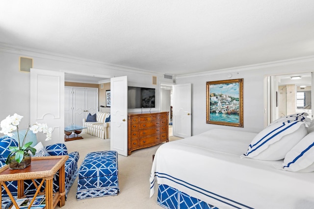 bedroom featuring a closet, carpet, and ornamental molding