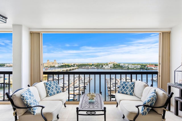 balcony with a water view and outdoor lounge area