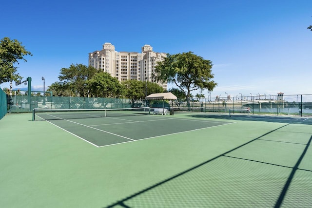 view of sport court with fence