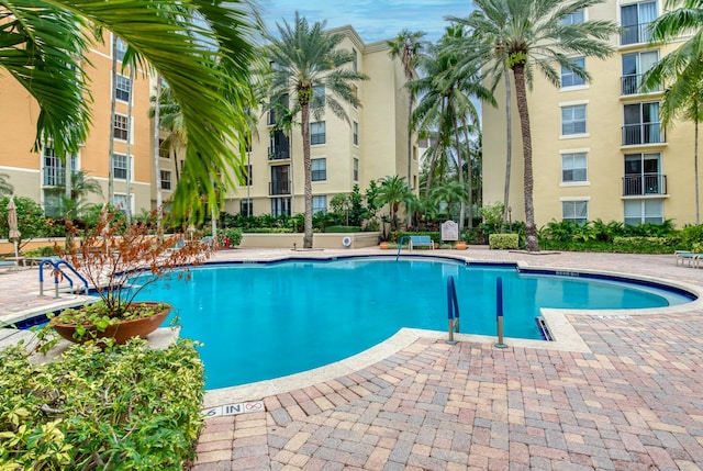 view of swimming pool with a patio area