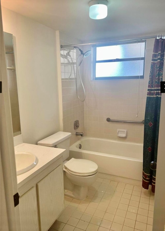 full bathroom featuring tile patterned flooring, shower / tub combo, vanity, and toilet