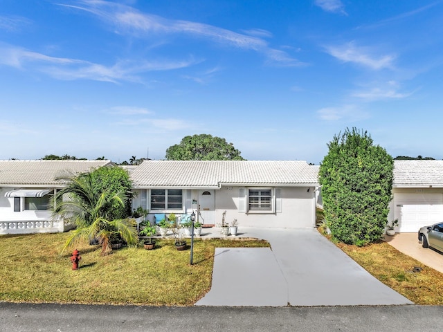 ranch-style home featuring a front yard