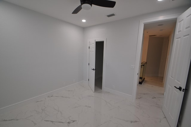 unfurnished bedroom featuring ceiling fan