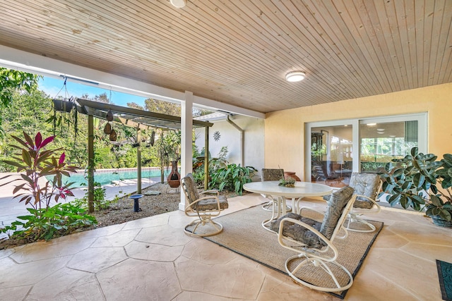 view of patio with an outdoor pool, a pergola, and outdoor dining space