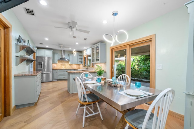 dining room featuring a ceiling fan, recessed lighting, visible vents, and light wood finished floors