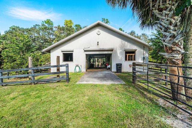 exterior space featuring fence and an outbuilding