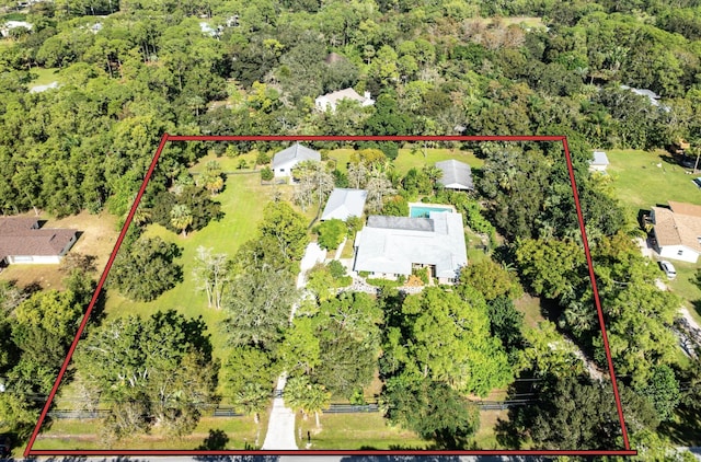 aerial view featuring a view of trees