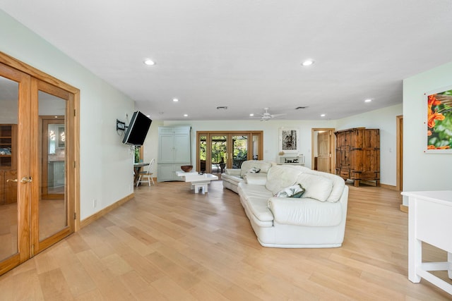 living area with light wood-type flooring, french doors, baseboards, and recessed lighting