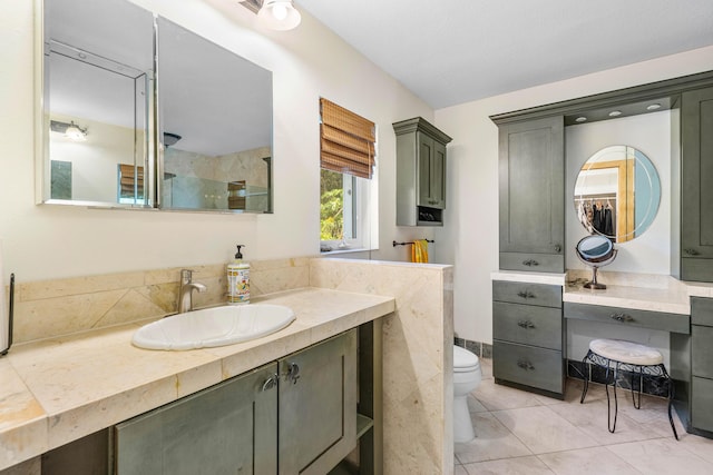 full bath featuring vanity, toilet, and tile patterned floors