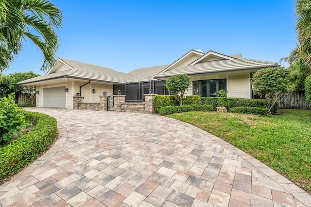 ranch-style house with a front yard and a garage