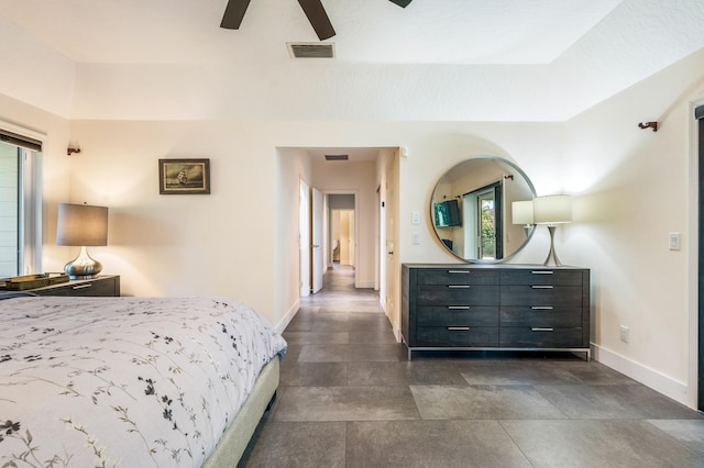 bedroom featuring multiple windows and ceiling fan