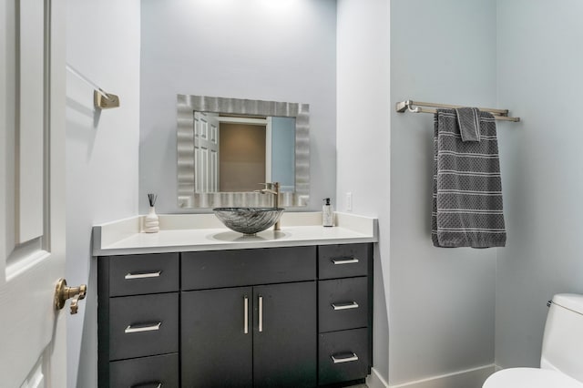 bathroom with vanity and toilet