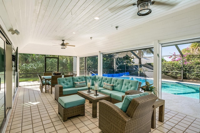 sunroom / solarium featuring ceiling fan, wooden ceiling, and vaulted ceiling