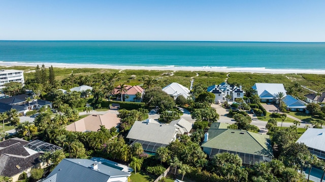 bird's eye view featuring a view of the beach and a water view