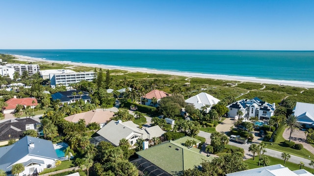 bird's eye view featuring a view of the beach and a water view