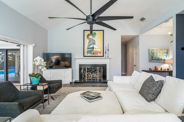 living room featuring ceiling fan and wood-type flooring