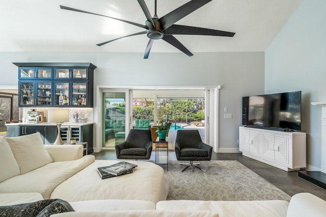 living room with ceiling fan and bar