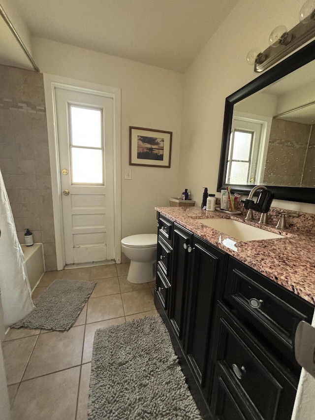 full bathroom with shower / bath combination with curtain, vanity, tile patterned floors, and a wealth of natural light