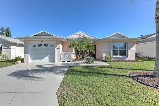 single story home with a garage and a front lawn