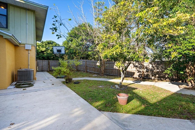 view of yard featuring a patio area and central air condition unit