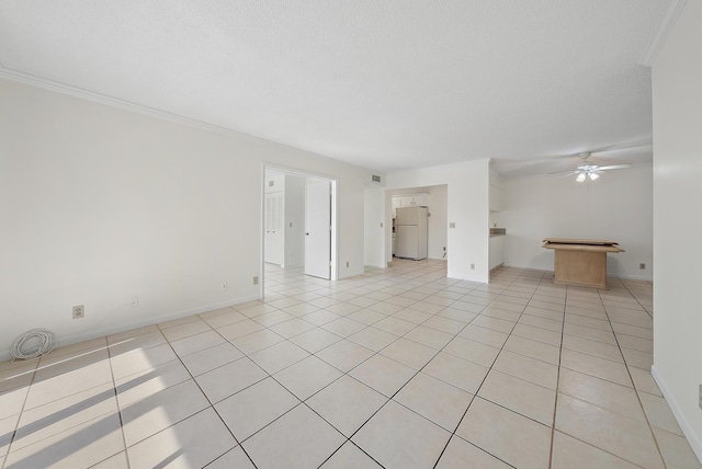 unfurnished living room with a textured ceiling, ceiling fan, light tile patterned floors, and crown molding