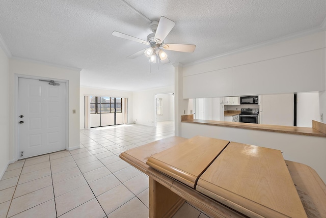 kitchen with white refrigerator, electric stove, ceiling fan, a textured ceiling, and light tile patterned flooring