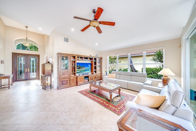 living room with french doors, high vaulted ceiling, ceiling fan, and light tile patterned flooring